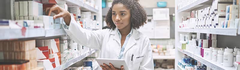 best-practices-pharmacy-content2 - Texas Hospital Association a pharmacist selects an item from the product shelves