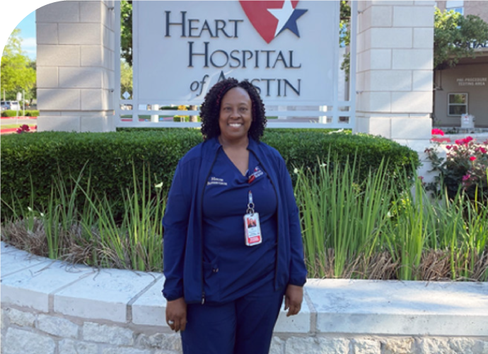 glasper_rdclg - Texas Hospital Association photo of Inger Glasper standing outside in front of a Heart Hospital of Austin sign