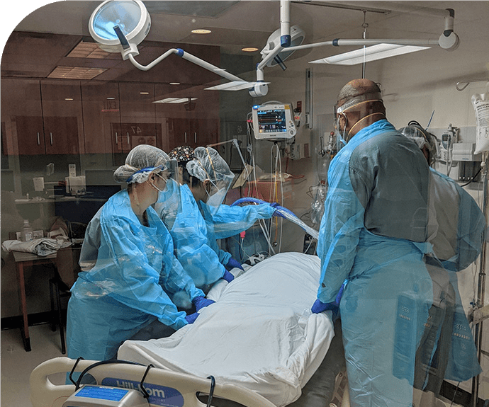 photo of a medical team in a surgical room attending to a patient