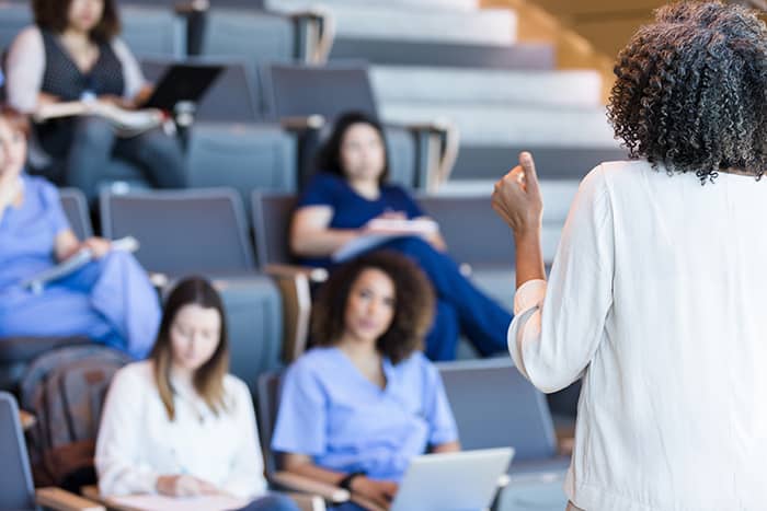 medical students listening to a professor's lecture