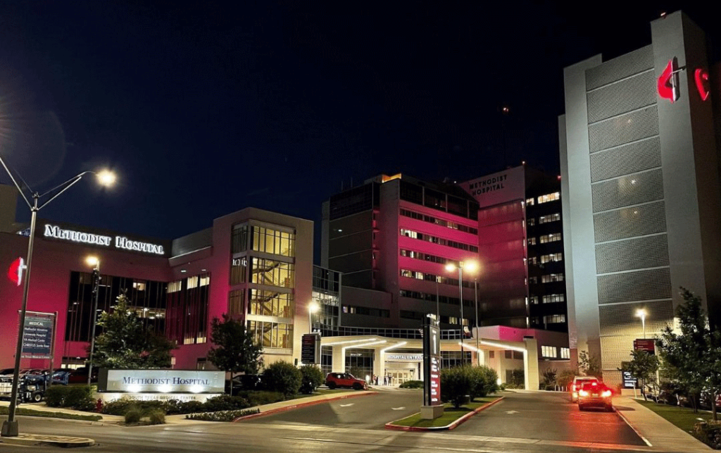 Methodist Hospital San Antonio with maroon and white exterior lights to honor Robb Elementary.