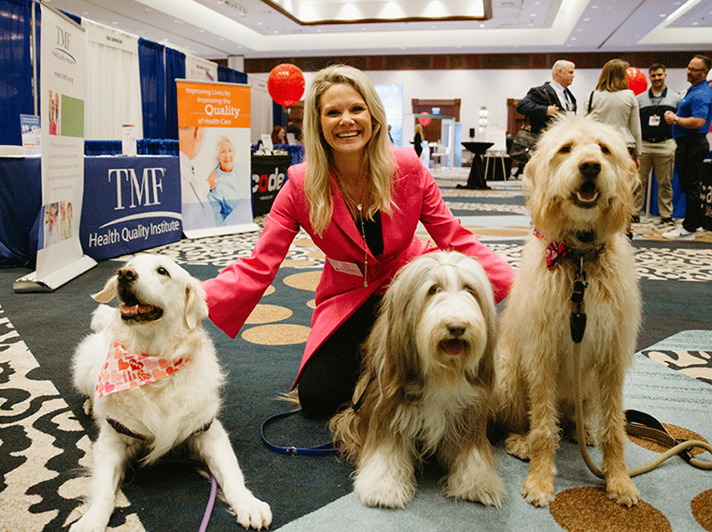 Petting dogs in the exhibit hall