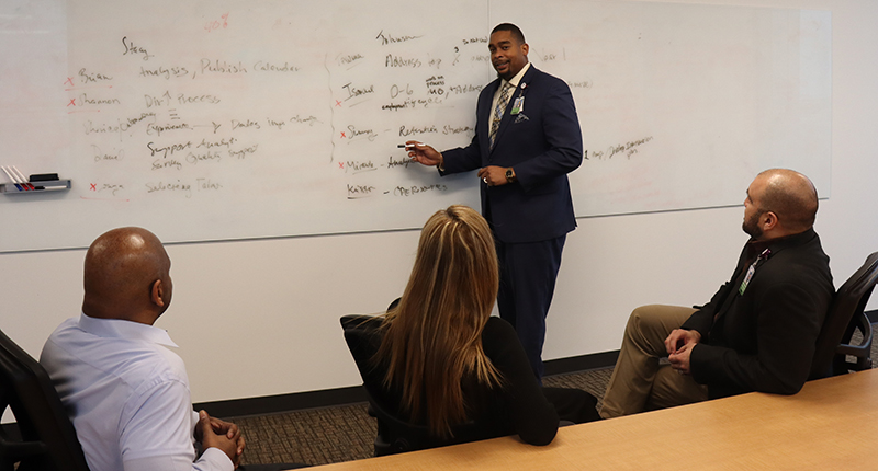 Johnson presenting during a meeting