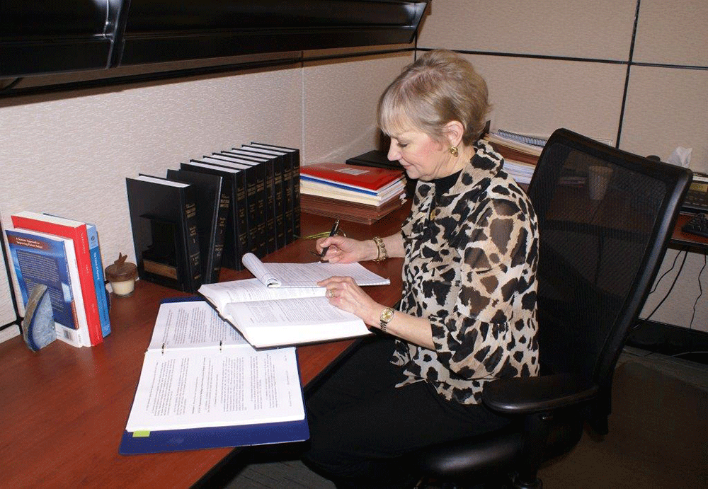 Sjoberg working at her desk in the Texas Hospital Association office.