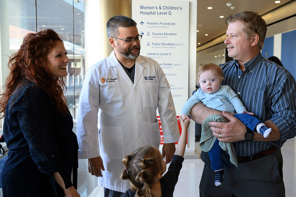 Dr. Abarbanell checks up on Theo Langer and his parents