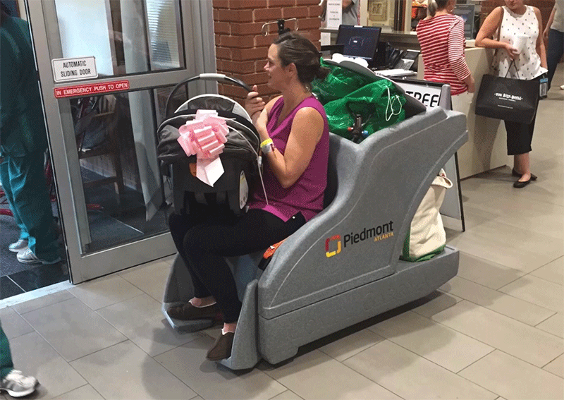 The Evolution of Patient Discharge Carts - Texas Hospital Association A patient and her belongings riding in a CarryAll cart.
