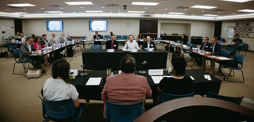 Antonio Cardenas (center) participates in a mock testimony session during THA's Leadership Fellows program.