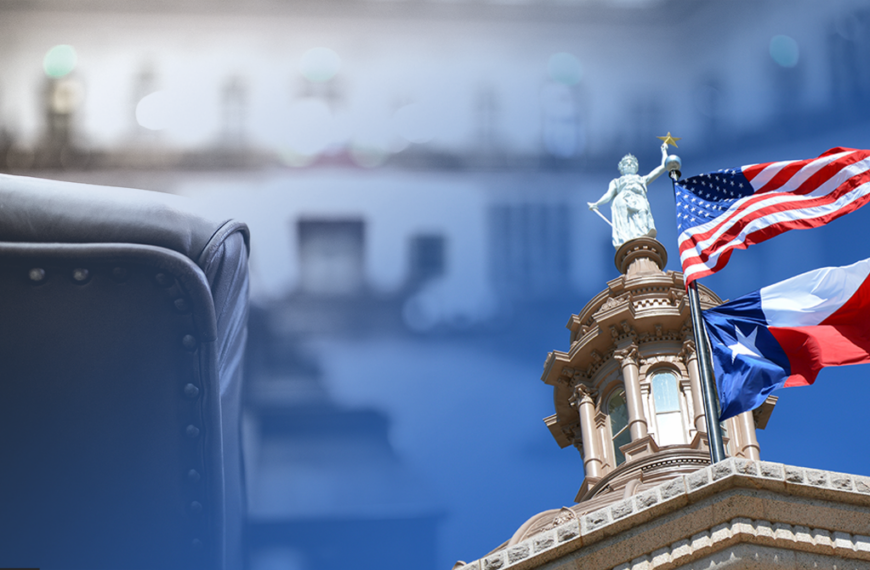 Leather chair in the foreground with a government building and waving US and Texas flags in the background.