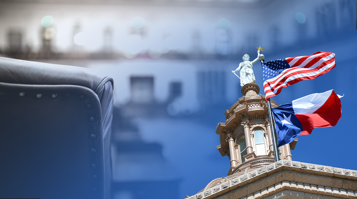 Leather chair in the foreground with a government building and waving US and Texas flags in the background.