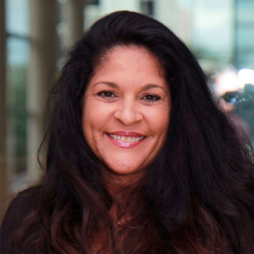 Carmen Bowling - Texas Hospital Association Smiling woman with long dark hair in an indoor setting, looking at the camera.